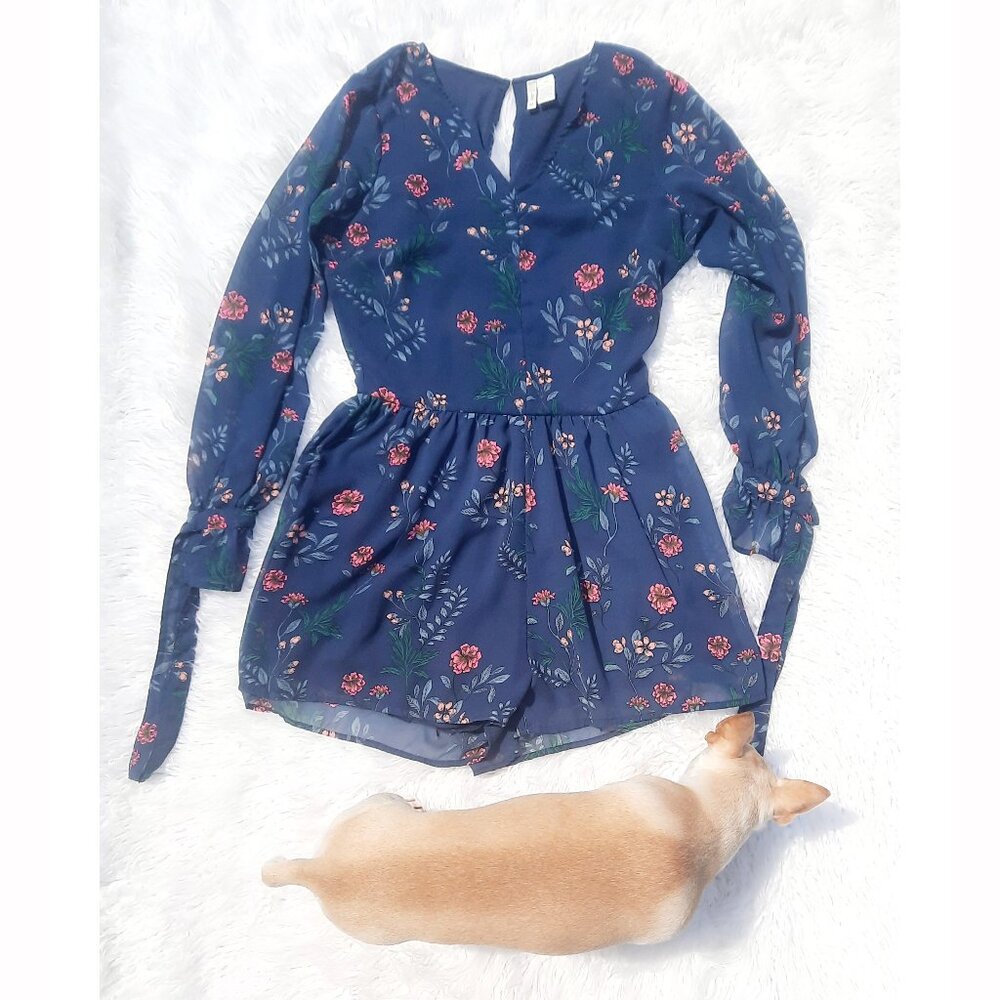 Relax in this stylish floral romper